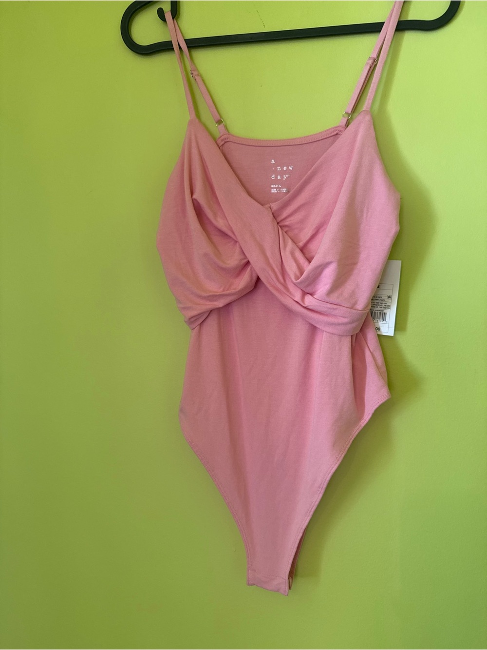 NWT A New Day pink bodysuit with criss-cross front detail, size small